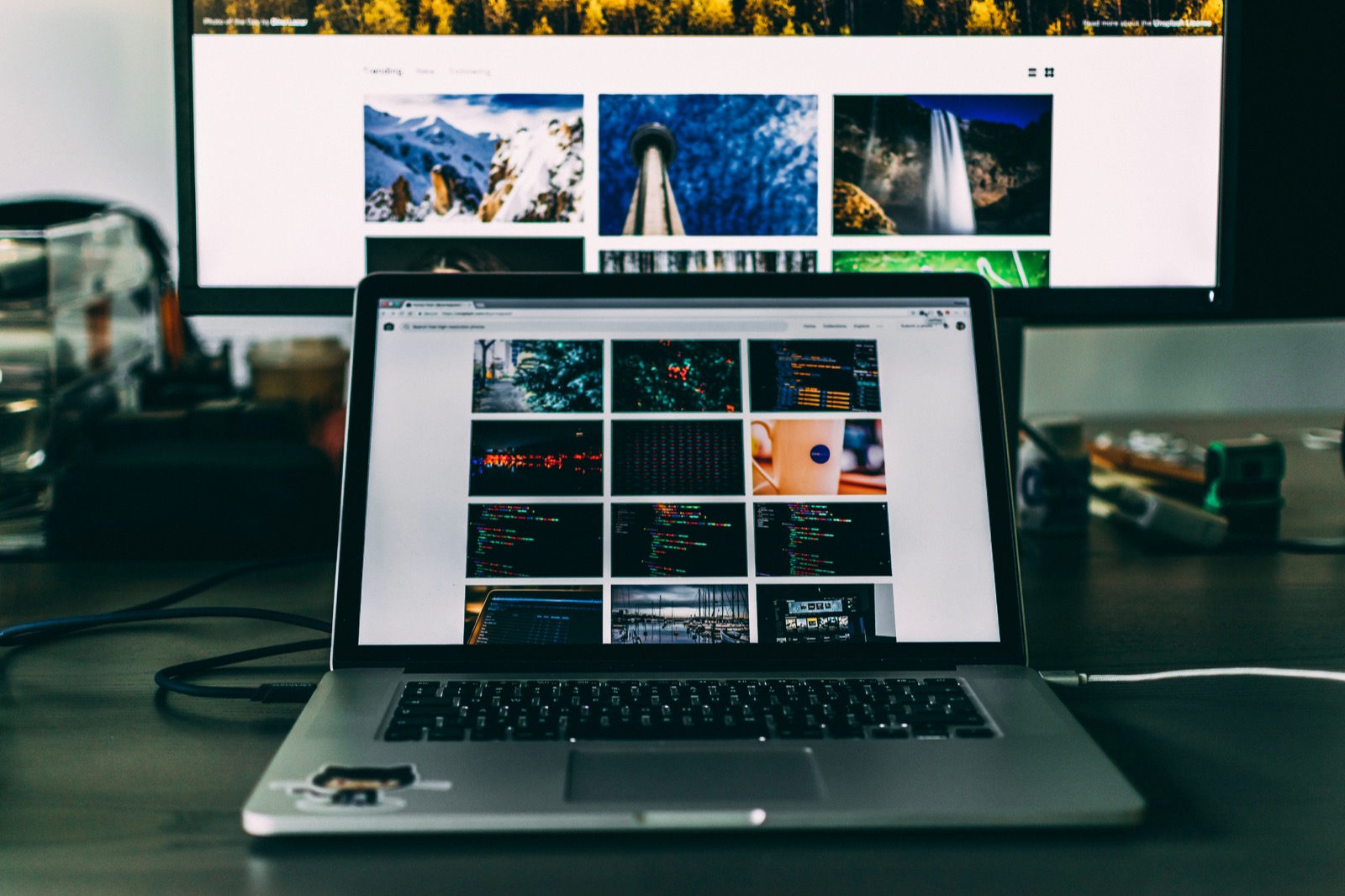 Laptop on a desk showing a curated gallery of product imagery